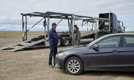 Vehicle owner beside their delivered car in Kalifornsky, Alaska, United States