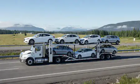 Multi-level car carrier on the highway to Ketchikan, Alaska, United States