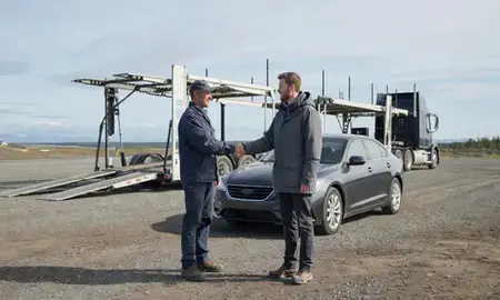 Vehicle owner beside their delivered car in Knik-Fairview, Alaska, United States