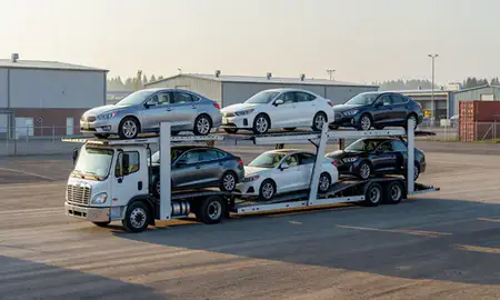 Car transporter loaded with vehicles in Meadow Lakes, Alaska, United States