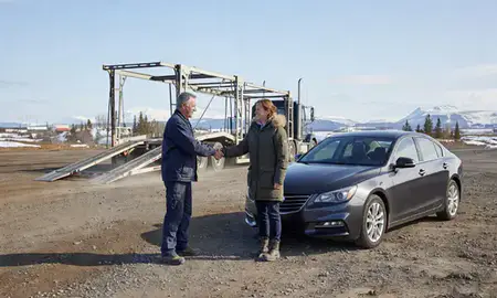 Vehicle owner beside their delivered car in Nikiski, Alaska, United States