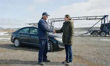 Vehicle owner beside their delivered car in Soldotna, Alaska, United States