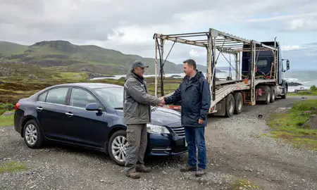 Vehicle owner beside their delivered car in Unalaska, Alaska, United States