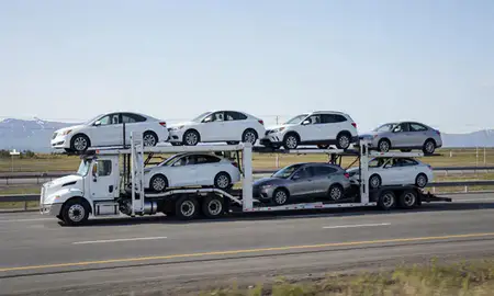 Multi-level car carrier on the highway to Wasilla, Alaska, United States