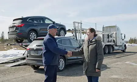 Vehicle owner beside their delivered car in Wasilla, Alaska, United States