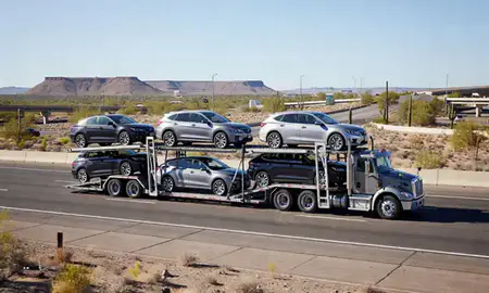 Multi-level car carrier on the highway to Arizona, United States