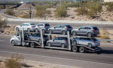 Multi-level car carrier on the highway to Buckeye, Arizona, United States