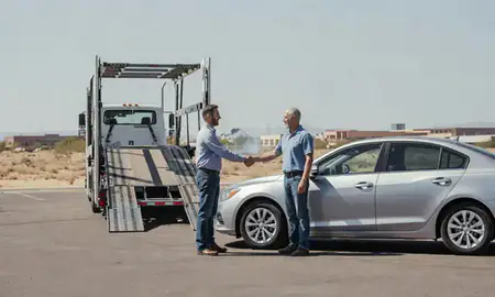 Vehicle owner beside their delivered car in Bullhead City, Arizona, United States