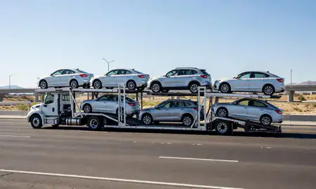 Multi-level car carrier on the highway to Casas Adobes, Arizona, United States