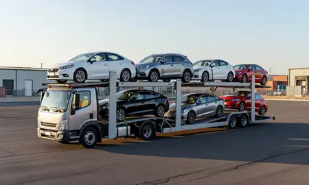 Car transporter loaded with vehicles in Casas Adobes, Arizona, United States