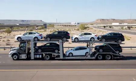 Multi-level car carrier on the highway to Goodyear, Arizona, United States
