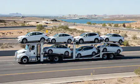 Multi-level car carrier on the highway to Lake Havasu City, Arizona, United States