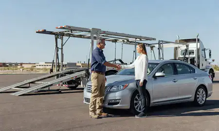 Vehicle owner beside their delivered car in Prescott, Arizona, United States