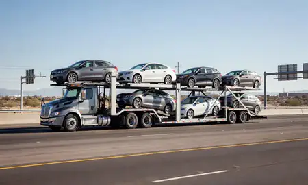 Multi-level car carrier on the highway to Scottsdale, Arizona, United States