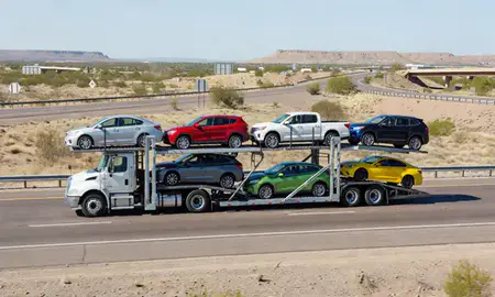 Multi-level car carrier on the highway to Surprise, Arizona, United States