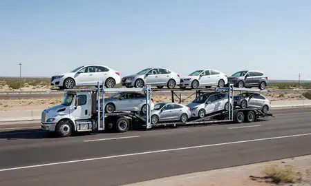Multi-level car carrier on the highway to Yuma, Arizona, United States