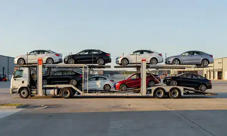 Car transporter parked in an industrial area of Bella Vista, Arkansas, United States