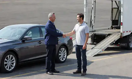 Vehicle owner beside their delivered car in Benton, Arkansas, United States