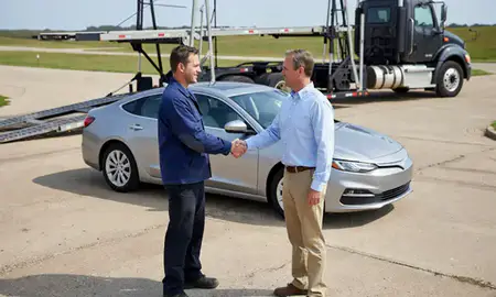 Vehicle owner beside their delivered car in Bentonville, Arkansas, United States