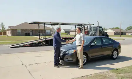 Vehicle owner beside their delivered car in Blytheville, Arkansas, United States