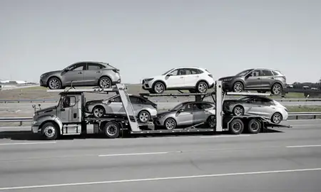 Multi-level car carrier on the highway to Bryant, Arkansas, United States