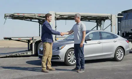 Vehicle owner beside their delivered car in Bryant, Arkansas, United States