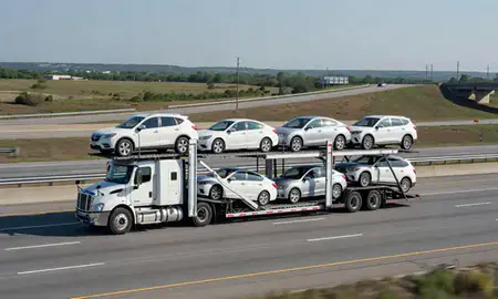Multi-level car carrier on the highway to Conway, Arkansas, United States