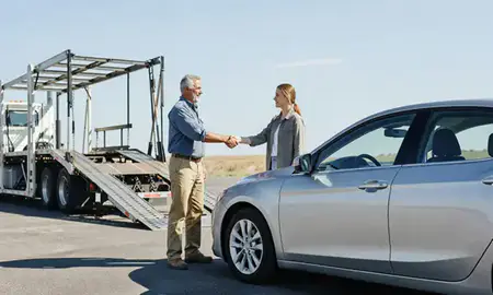 Vehicle owner beside their delivered car in Fayetteville, Arkansas, United States