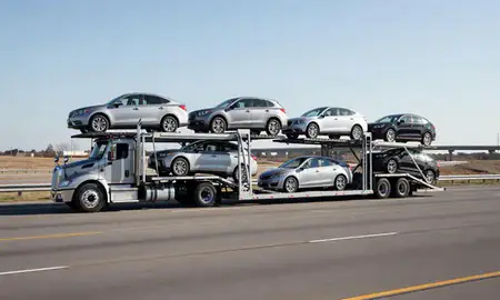 Multi-level car carrier on the highway to Fort Smith, Arkansas, United States