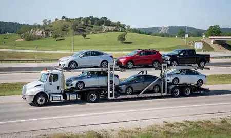 Multi-level car carrier on the highway to Hot Springs, Arkansas, United States
