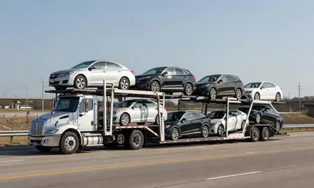 Multi-level car carrier on the highway to Jacksonville, Arkansas, United States