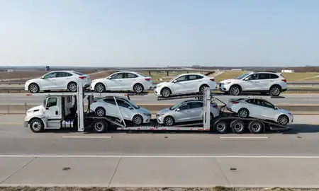 Multi-level car carrier on the highway to Jonesboro, Arkansas, United States
