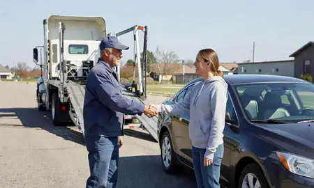 Vehicle owner beside their delivered car in Maumelle, Arkansas, United States