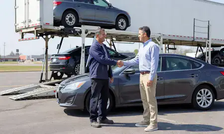 Vehicle owner beside their delivered car in North Little Rock, Arkansas, United States