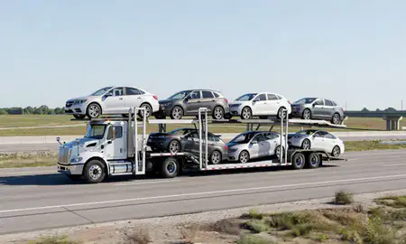 Multi-level car carrier on the highway to Paragould, Arkansas, United States