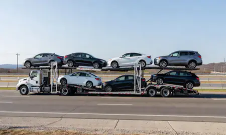 Multi-level car carrier on the highway to Pine Bluff, Arkansas, United States