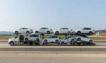 Multi-level car carrier on the highway to Rogers, Arkansas, United States