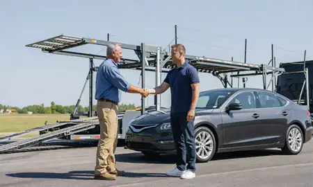 Vehicle owner beside their delivered car in Russellville, Arkansas, United States