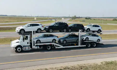 Multi-level car carrier on the highway to Searcy, Arkansas, United States