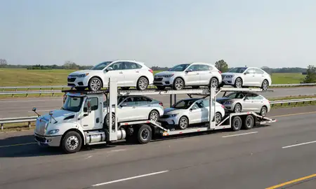 Multi-level car carrier on the highway to Sherwood, Arkansas, United States
