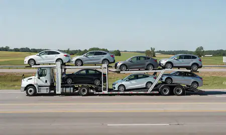 Multi-level car carrier on the highway to Siloam Springs, Arkansas, United States