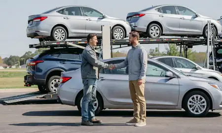 Vehicle owner beside their delivered car in Siloam Springs, Arkansas, United States
