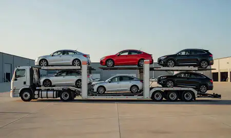 Car transporter parked in an industrial area of Siloam Springs, Arkansas, United States