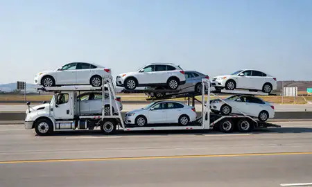Multi-level car carrier on the highway to Springdale, Arkansas, United States