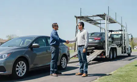 Vehicle owner beside their delivered car in Springdale, Arkansas, United States