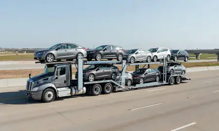 Multi-level car carrier on the highway to Texarkana, Arkansas, United States