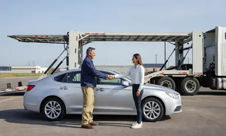 Vehicle owner beside their delivered car in Texarkana, Arkansas, United States