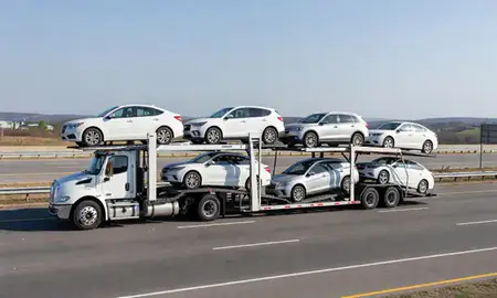Multi-level car carrier on the highway to Van Buren, Arkansas, United States