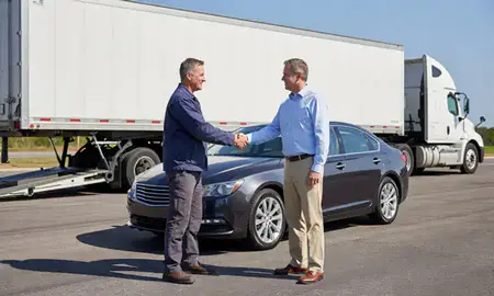 Vehicle owner beside their delivered car in Van Buren, Arkansas, United States
