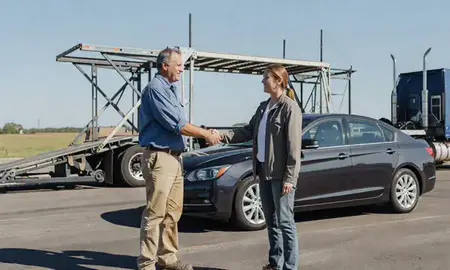 Vehicle owner beside their delivered car in West Memphis, Arkansas, United States